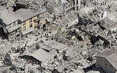 Rescuers search amid rubble following an earthquake in Amatrice Italy, Wednesday, August 24, 2016. (AP Photo/Gregorio Borgia)