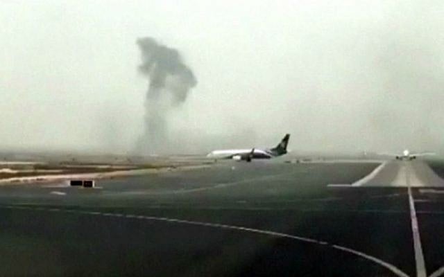 This image made from video shows smoke rising after an Emirates flight crash-landed at Dubai International Airport on Wednesday, Aug. 3, 2016. (Hayen Ayari via AP) This image made from video shows smoke rising after an Emirates flight crash-landed at Dubai International Airport on Wednesday, Aug. 3, 2016. (Hayen Ayari via AP)