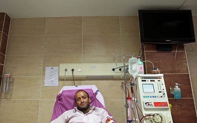 Hamidreza Amiri uses a dialysis machine as he waits for kidney transplant at a clinic in downtown Tehran, Iran, August 6, 2016. (AP/Ebrahim Noroozi)