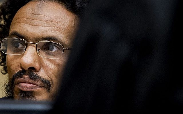 Ahmad Al Faqi Al Mahdi waits in the courtroom for his initial appearance at the International Criminal Court in The Hague, Netherlands. September 30, 2015 (AP Photo/Robin van Lonkhuijsen, Pool, File) Ahmad Al Faqi Al Mahdi waits in the courtroom for his initial appearance at the International Criminal Court in The Hague, Netherlands. September 30, 2015 (AP Photo/Robin van Lonkhuijsen, Pool, File)