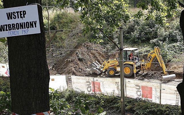 A sign warns against 'trespassing,' as heavy machinery begins the search to find a legendary Nazi train laden with treasure and armaments in Walbrzych, Poland, August 16, 2016. (AP Photo/Dariusz Gdesz) A sign warns against 'trespassing,' as heavy machinery begins the search to find a legendary Nazi train laden with treasure and armaments in Walbrzych, Poland, August 16, 2016. (AP Photo/Dariusz Gdesz)
