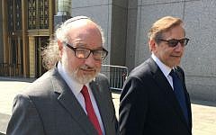 Jonathan Pollard (left), and his lawyer Eliot Lauer leave federal court in New York following a hearing, July 22, 2016. (AP/Larry Neumeister, File)