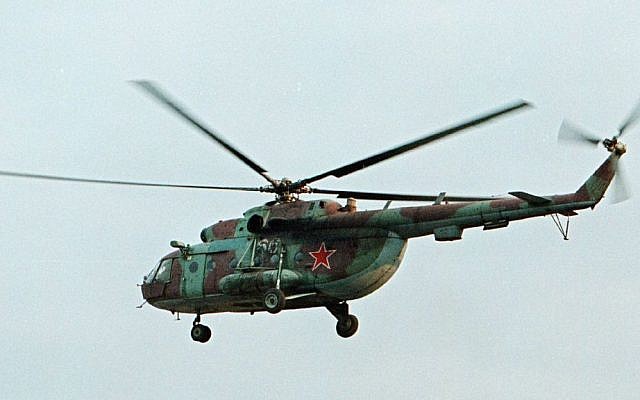 Illustrative: In this Sept. 18, 2002 file photo, an Mi-8 helicopter flies over the Chechen regional capital Grozny, Russia. (AP Photo/Musa Sadulayev, File)