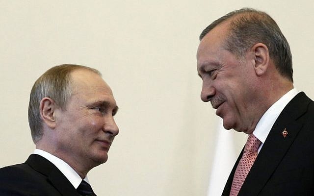 Russian President Vladimir Putin, left, welcomes Turkish President Recep Tayyip Erdogan in the Konstantin palace outside St. Petersburg, Russia, on Tuesday, Aug. 9, 2016. (AP Photo/Alexander Zemlianichenko)