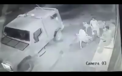 Security camera footage that appears to show soldiers in a military jeep throwing a smoke grenade at Palestinian men sitting outside a store in Kafr Laqif in the northern West Bank on August 15, 2016. (Screen capture: Ramallah News)