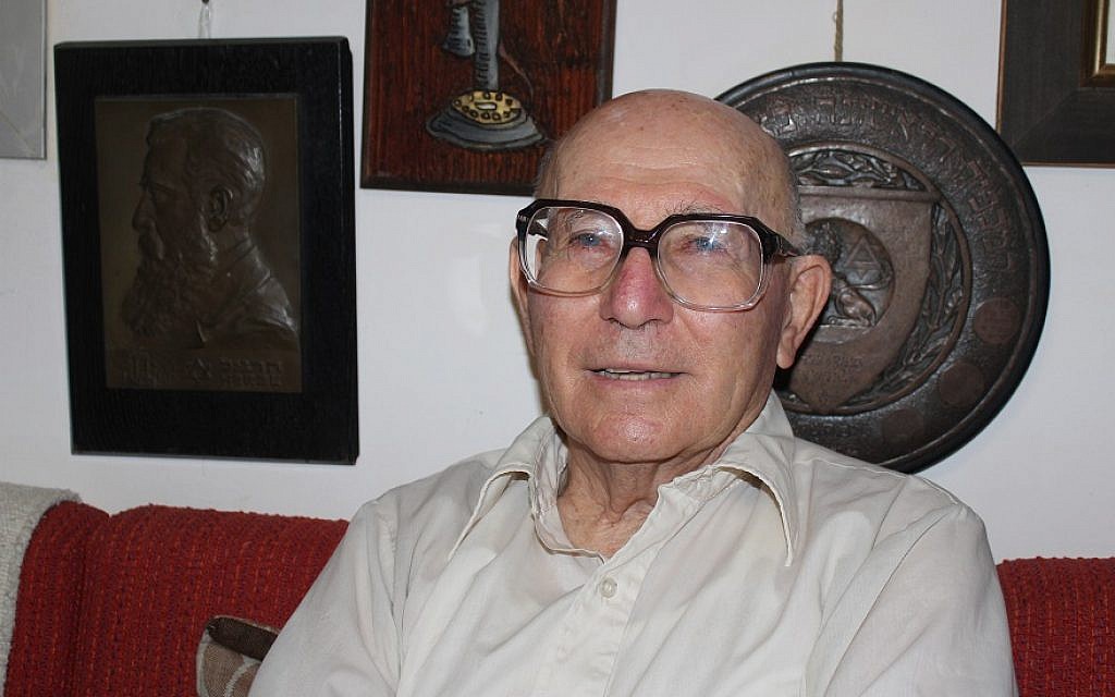 Shaul Ladany in his suburban Beersheba home with a prized piece of his Theodor Herzl collection, left. (Hillel Kuttler/JTA) Shaul Ladany in his suburban Beersheba home with a prized piece of his Theodor Herzl collection, left. (Hillel Kuttler/JTA)