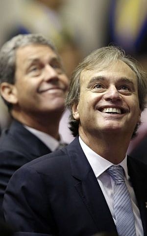 Interior Minister Carlos Basombrio, foreground, and Finance Minister Alfredo Thorne attend the inauguration ceremony for President Pedro Pablo Kuczynski at Congress in Lima, Peru, July 28, 2016. (AP Photo/Martin Mejia)