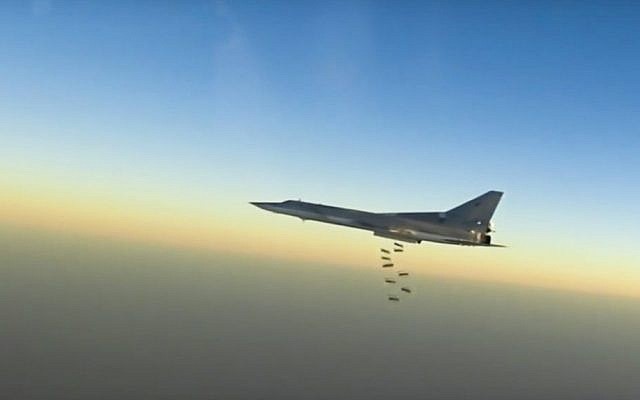In this frame grab from video provided by the Russian Defense Ministry Press Service, Russian long range bomber Tu-22M3 flies during a strike above an undisclosed location in Syria on Sunday, Aug. 14, 2015. (Russian Defense Ministry press service photo via AP)