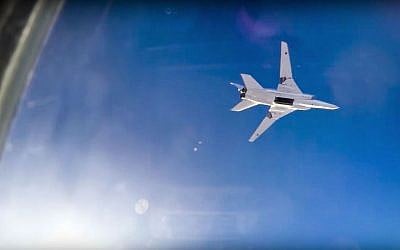 In this frame grab from video provided by the Russian Defense Ministry press service, a Russian long range Tu-22M3 bomber flies during an air strike over the Aleppo region of Syria on Tuesday, Aug. 16, 2016. (Russian Defense Ministry Press Service photo via AP)