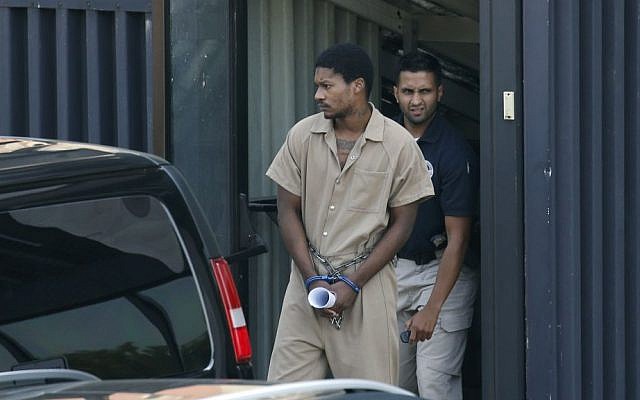 Emanuel Lutchman, who pleaded guilty to conspiracy to support the Islamic State, is transported out of a federal building in Rochester, New York, on August 11, 2016. (Carlos Ortiz/Democrat & Chronicle via AP) Emanuel Lutchman, who pleaded guilty to conspiracy to support the Islamic State, is transported out of a federal building in Rochester, New York, on August 11, 2016. (Carlos Ortiz/Democrat & Chronicle via AP)