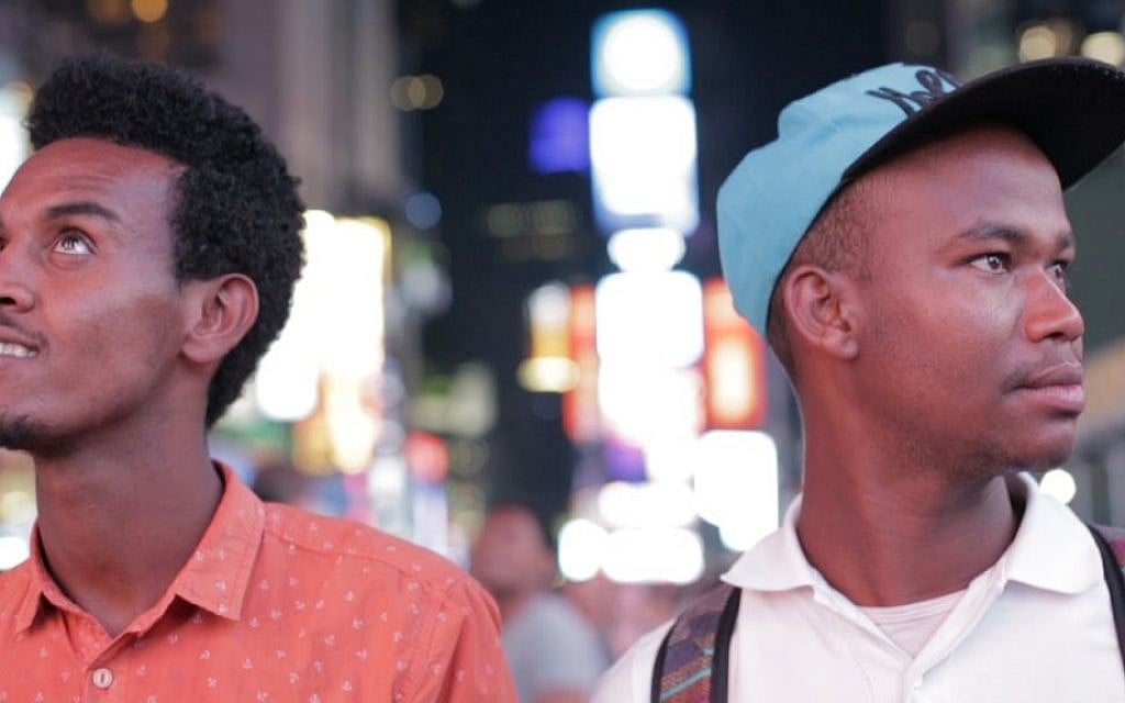 Gezahegn Dereve (left) and Demoz Deboch check out Times Square, NYC on August 6, 2016, on their five week speaking tour through the US to raise awareness about Jews in Ethiopia waiting to move to Israel. (courtesy Ryan Porush) Gezahegn Dereve (left) and Demoz Deboch check out Times Square, NYC on August 6, 2016, on their five week speaking tour through the US to raise awareness about Jews in Ethiopia waiting to move to Israel. (courtesy Ryan Porush)