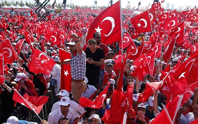 Turks wave flags of their country as they attend a rally in Istanbul, Sunday, August 7, 2016. (AP/Emrah Gurel)