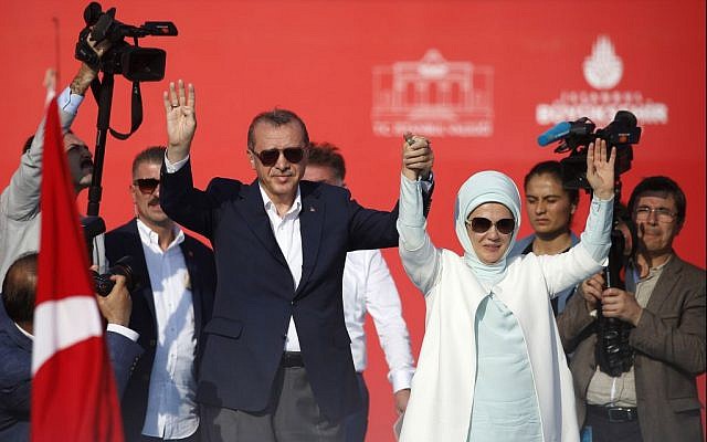 Turkish President Recep Tayyip Erdogan, left, and his wife Emine wave to the crowd during a rally in Istanbul, Sunday, August 7, 2016. (AP/Emrah Gurel)