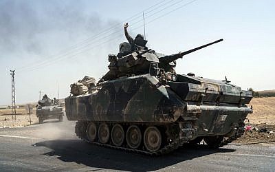 Turkish troops heading to the Syrian border, in Karkamis, Turkey, August 27, 2016. (AP Photo/Halit Onur Sandal) Turkish troops heading to the Syrian border, in Karkamis, Turkey, August 27, 2016. (AP Photo/Halit Onur Sandal)
