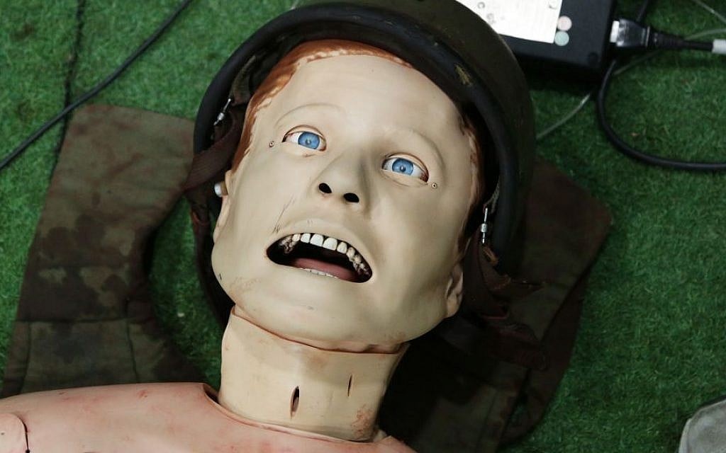 A high-tech mannequin in one of the Medical Trauma Simulator's single casualty rooms. Trainees can perform operations on the mannequin's neck, and its pupils can dilate to simulate a brain injury. (Luke Tress/Times of Israel) A high-tech mannequin in one of the Medical Trauma Simulator's single casualty rooms. Trainees can perform operations on the mannequin's neck, and its pupils can dilate to simulate a brain injury. (Luke Tress/Times of Israel)