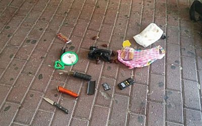 Two knives and a cellphone discovered in the backpack of Ali Abu Hassan, a Palestinian man who has been accused of attempting to bomb the Jerusalem light rail on July 17, 2016. (Israel Police)