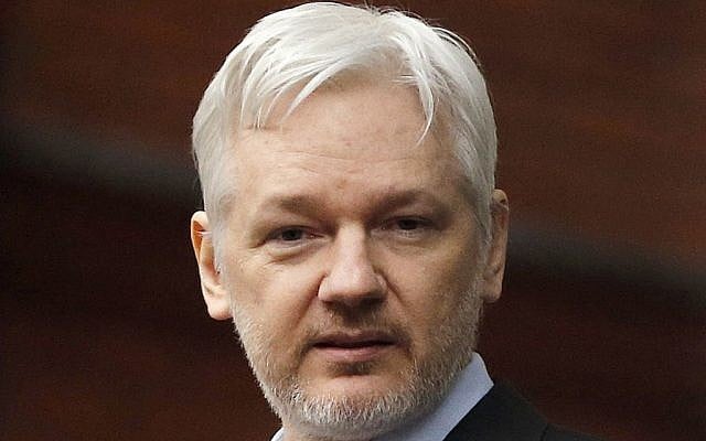 WikiLeaks founder Julian Assange stands on the balcony of the Ecuadorean Embassy in London, February 5, 2016. (AP Photo/Frank Augstein, File)