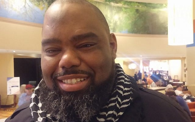 Florida State Sen. Dwight Bullard, wearing a Palestinian kaffiyeh, or headscarf, at the Democratic National Convention, July 2016. (Ben Sales)