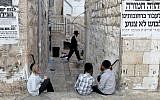 Illustrative: Young ultra-Orthodox Jewish boys sit in the streets in the Mea Shearim neighborhood in Jerusalem on September 16, 2010. (Nati Shohat / Flash90)