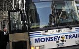 Illustrative photo of ultra-Orthodox Jewish men boarding a bus to Monsey in Rockland County New York, Manhattan, New York, June 17, 2013. (Serge Attal / Flash90)