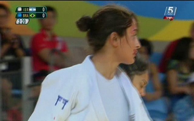 Israeli judoka Yarden Gerbi bleeds from the mouth during the quarterfinal match against Brazil's Mariana Silva in the Olympic women's judo under-63 kilograms competition in Rio de Janeiro, August 9, 2016. (screen shot Channel 55)