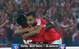 Players from Israel's Hapoel Beersheba FC celebrate the victory against Greek team Olympiacos FC on August 3, 2016 at the Turner Stadium in Beersheba. (screen capture:YouTube)