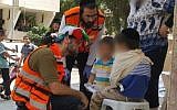 Medic Daniel Klughaupt dons his clown costume when treating an Israeli boy who was hit by a minibus in central Israel, on Thursday August 11 2016. (Courtesy United Hatzalah)
