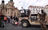 Anti-Islamic activists simulate a terror attack by the Islamic State jihadist group in downtown Prague, Czech Republic on August 21, 2016. (screen capture: YouTube)