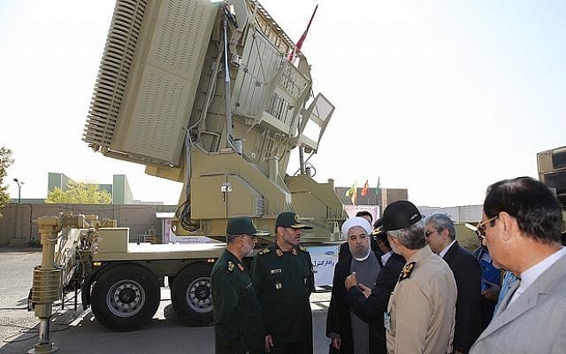 A handout picture provided by the office of Iranian President Hassan Rouhani on August 21, 2016 shows him (3rd-R) and Iranian Defence Minister Hossein Dehghan (2nd-L) standing next to the new Bavar 373 missile defence system in Tehran.
The system was designed to intercept cruise missiles, drones, combat aircraft and ballistic missiles, according to earlier statements by Dehghan. (AFP PHOTO / IRANIAN PRESIDENCY) A handout picture provided by the office of Iranian President Hassan Rouhani on August 21, 2016 shows him (3rd-R) and Iranian Defence Minister Hossein Dehghan (2nd-L) standing next to the new Bavar 373 missile defence system in Tehran.
The system was designed to intercept cruise missiles, drones, combat aircraft and ballistic missiles, according to earlier statements by Dehghan. (AFP PHOTO / IRANIAN PRESIDENCY)