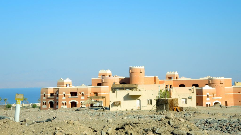 The tourism bust in the Sinai peninsula has left many half-built hotels dotting the beach directly south of Taba, including this abandoned project, seen on August 11, 2016. The kilometers of abandoned hotels and empty roads next to Taba make it seem like the area has survived some kind of apocalypse. (Melanie Lidman/Times of Israel)