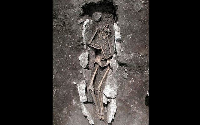 This undated photo released Aug. 10, 2016, provided by the Greek Culture Ministry, shows the 11th century BCE skeleton of a teenager excavated recently at Mount Lykaion in the southern Peloponnese region of Greece, the mountaintop sanctuary of Zeus, king of the ancient Greek gods. (Greek Culture Ministry via AP) This undated photo released Aug. 10, 2016, provided by the Greek Culture Ministry, shows the 11th century BCE skeleton of a teenager excavated recently at Mount Lykaion in the southern Peloponnese region of Greece, the mountaintop sanctuary of Zeus, king of the ancient Greek gods. (Greek Culture Ministry via AP)