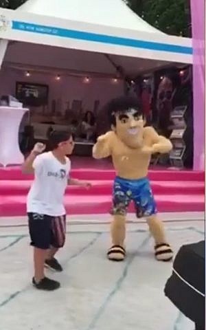 A "stereotypical" Israeli doll dances at the Stockholm pride parade on July 31, 2016. (screen capture: Ynet)