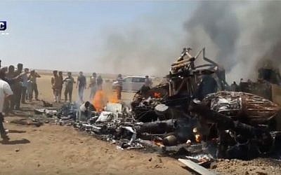 An image purportedly showing the wreckage of a Russian military helicopter shot down over Idlib, Syria on August 1, 2016. (screen capture: YouTube)