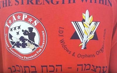 Illustrative image of a t-shirt from an IDF Widows and Orphans Organization and Tragedy Assistance Program for Survivors joint program. (IDF Widows & Orphans Organization/YouTube)