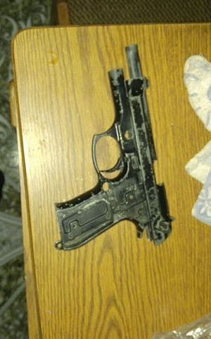 A pistol uncovered by IDF troops during a night-time raid near Hebron on August 17, 2016. (IDF Spokesperson's Unit) A pistol uncovered by IDF troops during a night-time raid near Hebron on August 17, 2016. (IDF Spokesperson's Unit)