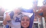 Olympic beach volleyball contender Doaa Elghobashy smiles for a photo as a woman wearing an Israel flag poses behind, August 2016, Courtesy Facebook
