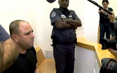 Muhammad Zoabi, accused of buying weapons stolen from the army, seen at a court hearing in Beersheba. (Screen capture: Walla news) Muhammad Zoabi, accused of buying weapons stolen from the army, seen at a court hearing in Beersheba. (Screen capture: Walla news)