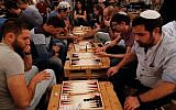 Palestinians and Israelis take part in a backgammon tournament in Jerusalem on August 31, 2016. (AFP PHOTO / GIL COHEN-MAGEN)