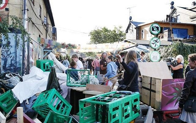 Residents clean the area in the Freetown Christiania neighborhood of Copenhagen, on September 2, 2016, after two police officers were shot in a drugs raid. (Scanpix Denmark /Uffe Weng /AFP) Residents clean the area in the Freetown Christiania neighborhood of Copenhagen, on September 2, 2016, after two police officers were shot in a drugs raid. (Scanpix Denmark /Uffe Weng /AFP)