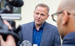Top candidate of the populist right party Alternative for Germany (AfD), Leif-Erik Holm, talks to the media  during the regional elections in Barner Stueck, near Klein Trebbow, Mecklenburg-Western Pomerania, eastern Germany, on September 4, 2016. (AFP PHOTO / dpa / Daniel Bockwoldt)