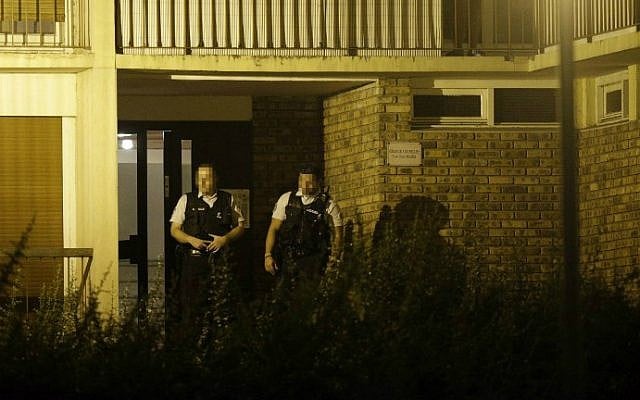 French police stand outside the building in Boussy-Saint-Antoine, south of Paris, on September 8, 2016 where female suspects said to have been planning new acts of jihadist violence were arrested. (Geoffroy van der Hasselt/AFP) French police stand outside the building in Boussy-Saint-Antoine, south of Paris, on September 8, 2016 where female suspects said to have been planning new acts of jihadist violence were arrested. (Geoffroy van der Hasselt/AFP)