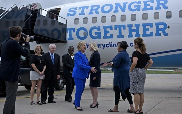 Democratic presidential nominee Hillary Clinton is greeted at Charles B. Wheeler Downtown Airport on September 8, 2016 in Kansas City, Missouri. (AFP PHOTO / Brendan Smialowski) Democratic presidential nominee Hillary Clinton is greeted at Charles B. Wheeler Downtown Airport on September 8, 2016 in Kansas City, Missouri. (AFP PHOTO / Brendan Smialowski)