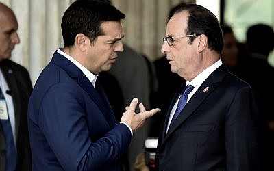 French President Francois Hollande (R) speaks with Greek Prime Minister Alexis Tsipras during the EU MED Mediterranean Economies Summit in Athens on September 9, 2016. (AFP PHOTO/ARIS MESSINIS)