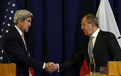 US Secretary of State John Kerry and Russian Foreign Minister Sergei Lavrov shake hands at a press conference in Geneva on September 9, 2016, where they announced a new plan for a ceasefire in the Syrian civil war and the foundation of a peace process. (AFP PHOTO/POOL/KEVIN LAMARQUE)
