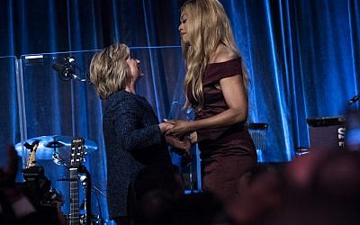 Democratic presidential nominee Hillary Clinton (L) is greeted by actress Laverne Cox during an LGBT for Hillary Gala at the Cipriani in New York on September 9, 2016. (AFP PHOTO/Brendan Smialowski)