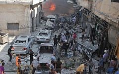 Syrians search for victims at the scene of a reported airstrike on the rebel-held northwestern city of Idlib on September 10, 2016. (AFP Photo/Omar Haj Kadour)