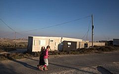 Israeli children from the West Bank settlement of Amona walk past their homes, September 7, 2016. (AFP Photo/Menahem Kahana)