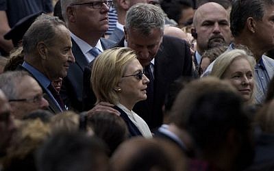 New York City Mayor Bill de Blasio speaks to US Democratic presidential nominee Hillary Clinton during a memorial service at the National 9/11 Memorial on September 11, 2016 in New York. (Brendan Smialowski/AFP)