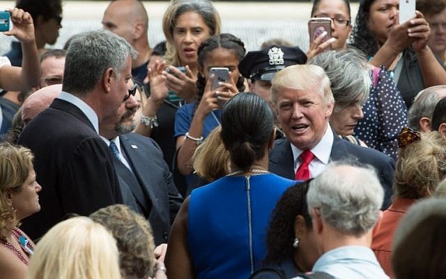Republican presidential nominee Donald Trump during the 15th anniversary commemoration of the September 11 attacks at the 9/11 Memorial and Museum, Sunday, September 11, 2016 in New York. (AFP Photo/Bryan R. Smith)