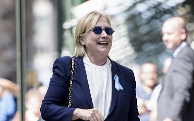 US Democratic presidential nominee Hillary Clinton leaves her daughter's apartment building after resting on September 11, 2016, in New York. (AFP/ Brendan Smialowski)